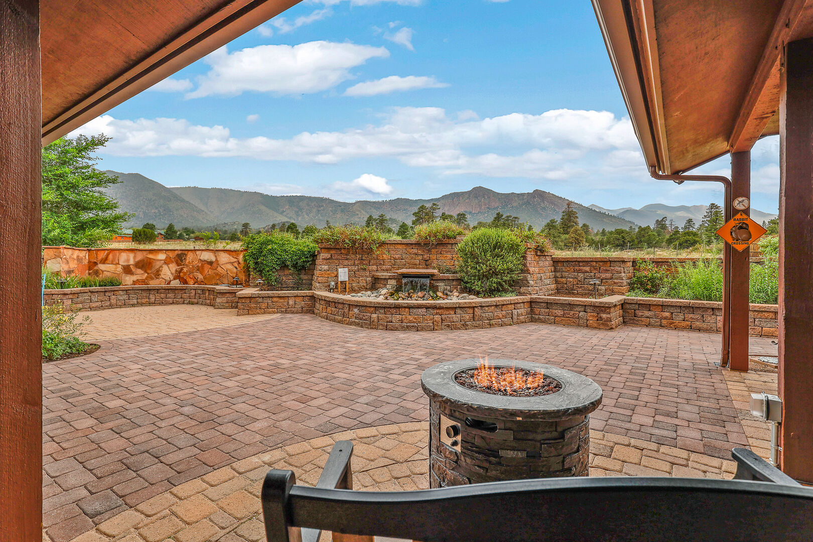 Beautiful mountain view patio with fire pit and stone work